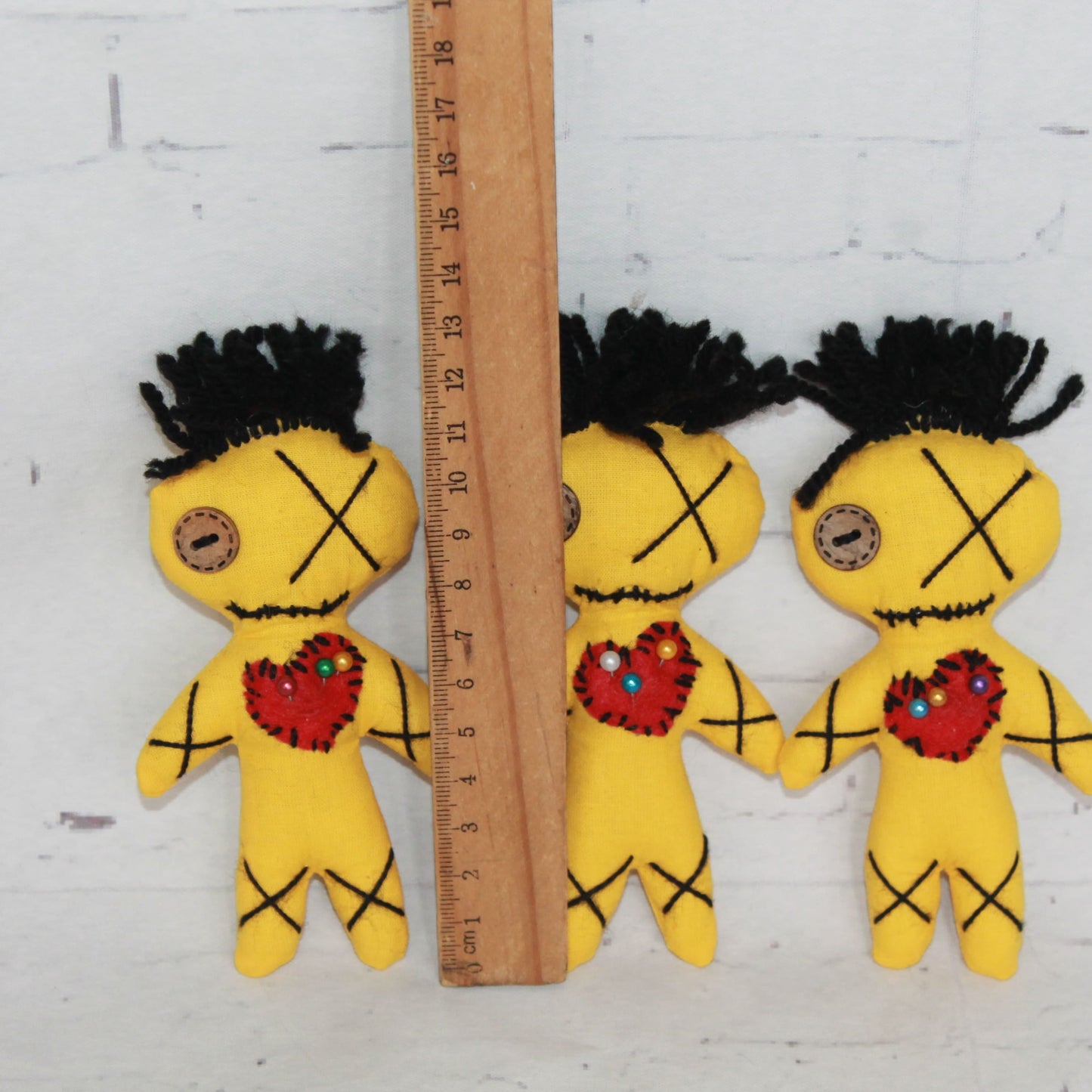 cute voodoo doll with pins