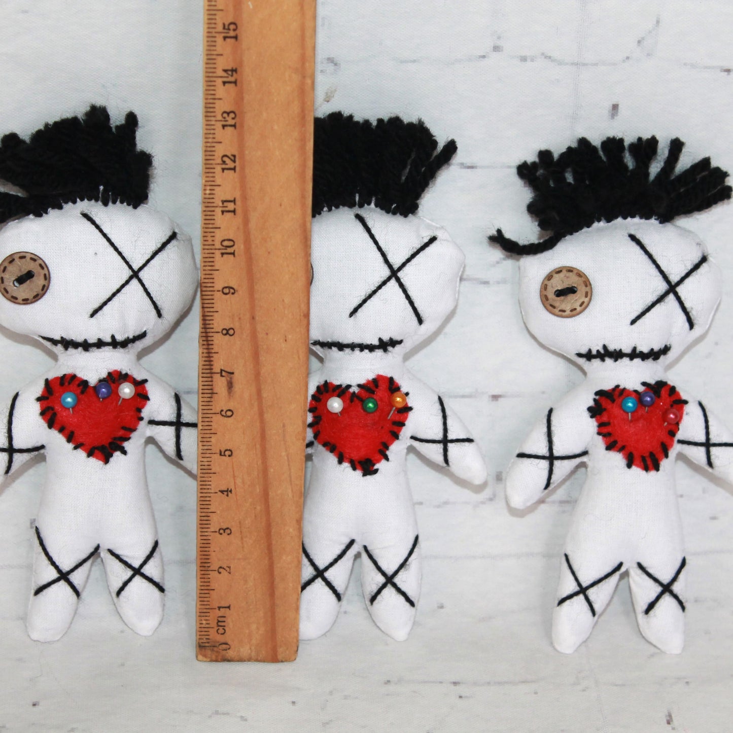 Mini white felt voodoo dolls with hearts – love spell plushies
